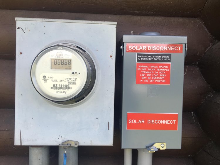 Utility usage Meter Utility meter and solar discconection box.