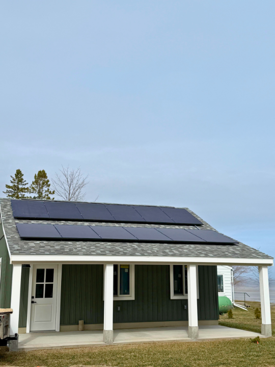 Roof-mounted solar array on a lakefront home in Escanaba, MI