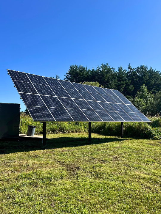 Ground-mounted solar array with adjustable racking for a seasonal cabin in the Keweenaw Peninsula in Michigan's Upper Peninsula