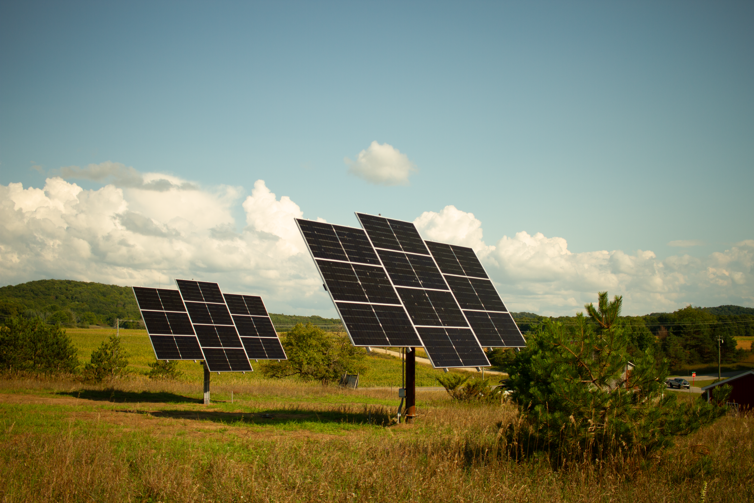 dual ground-mounted solar arrays for a remote property in Leelanau County