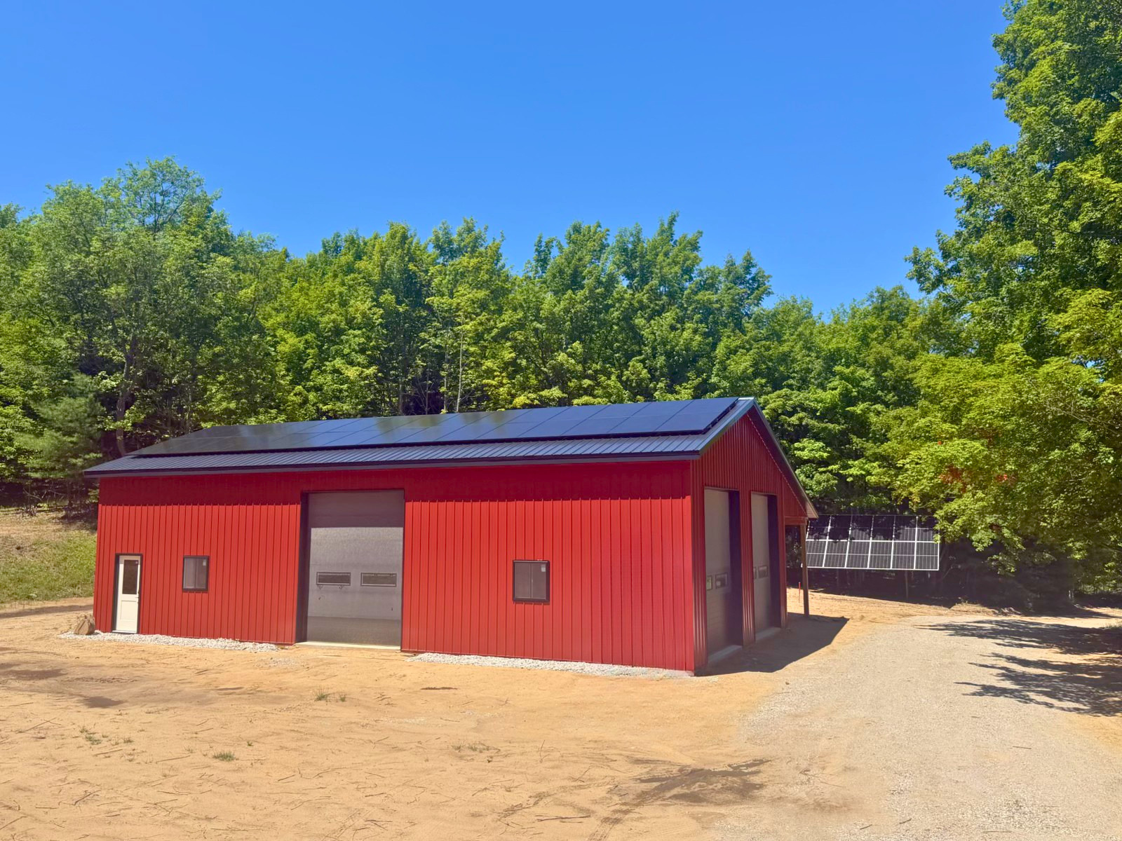 ground and roof solar array installation for a residential home in Traverse City, MI